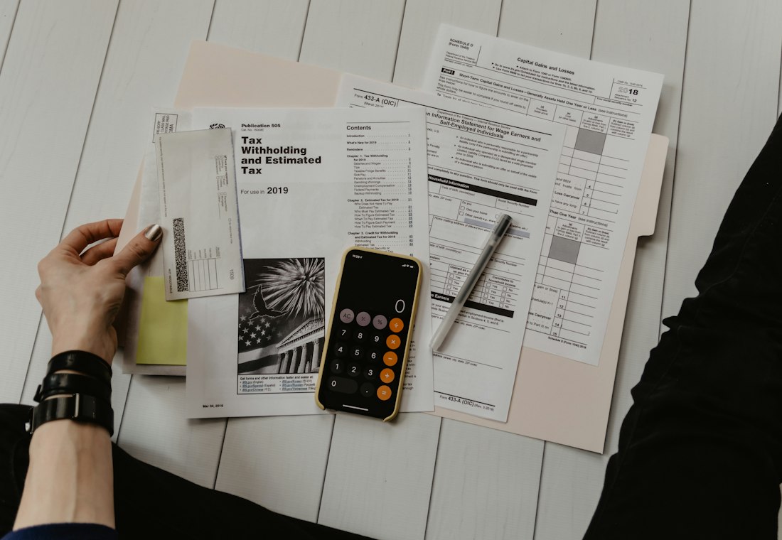 Organized business documents and records on a desk